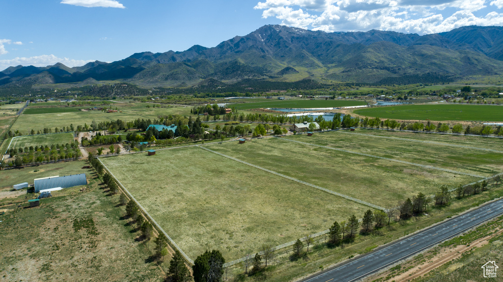 Aerial view featuring a rural view and a water and mountain view