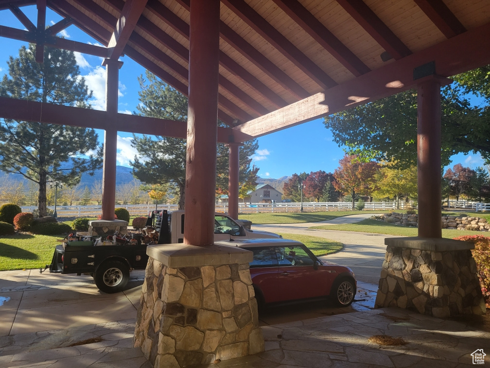 View of patio featuring fence