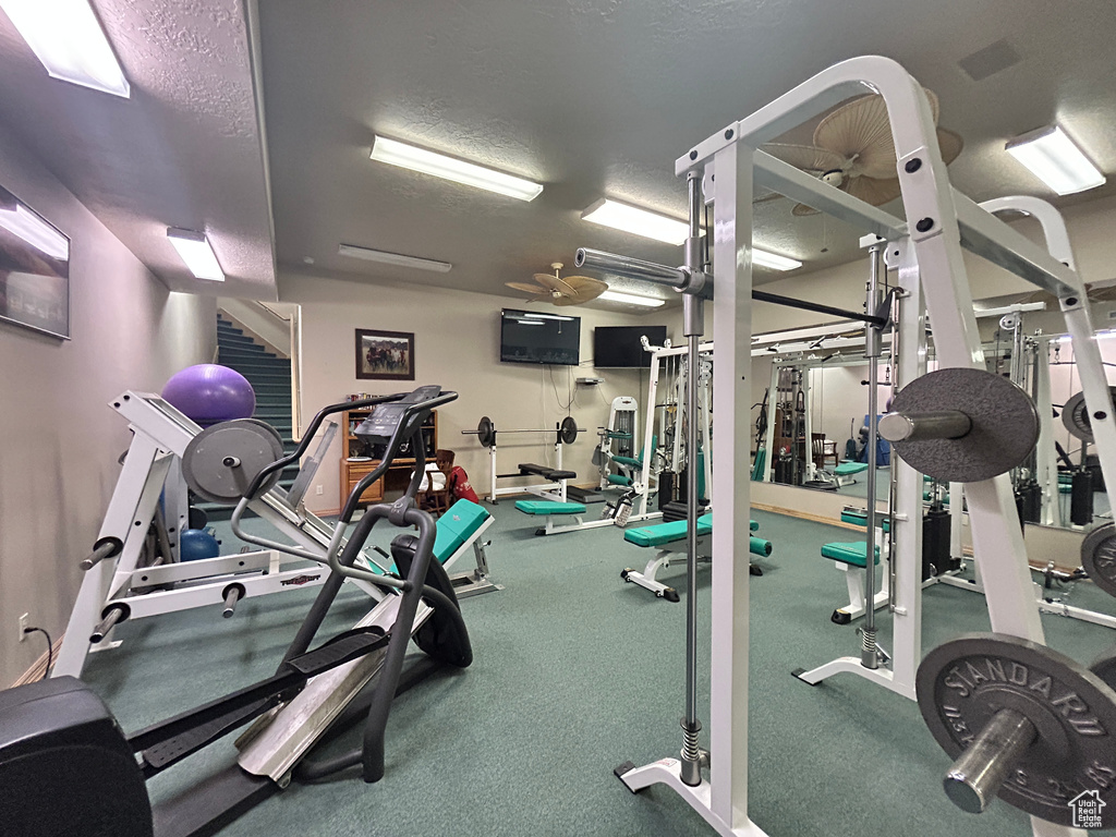 Gym featuring a textured ceiling