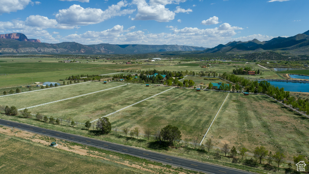 Aerial view featuring a water and mountain view and a rural view