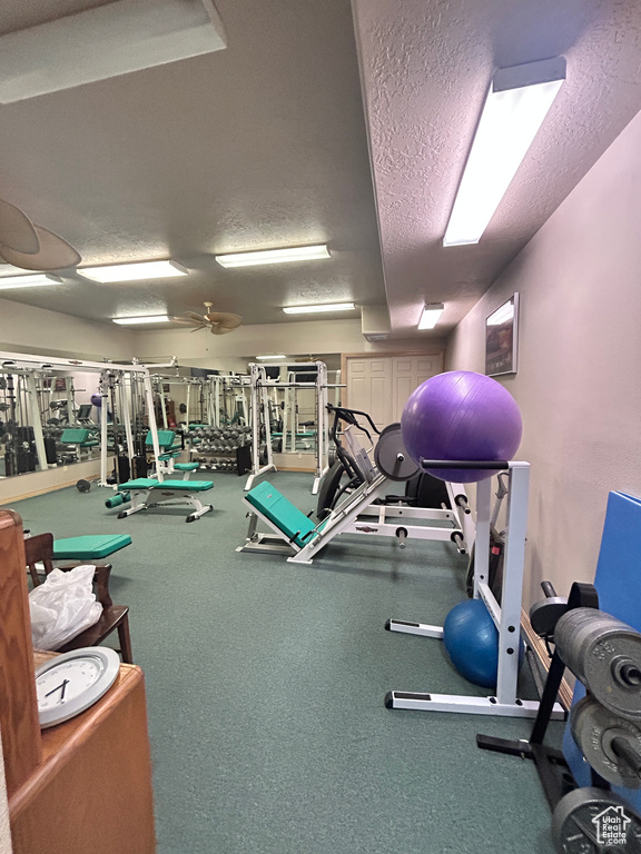Workout area featuring a textured ceiling