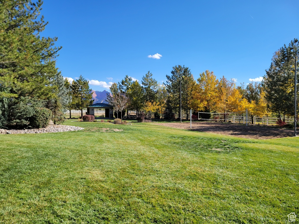 View of yard featuring a gazebo and volleyball court