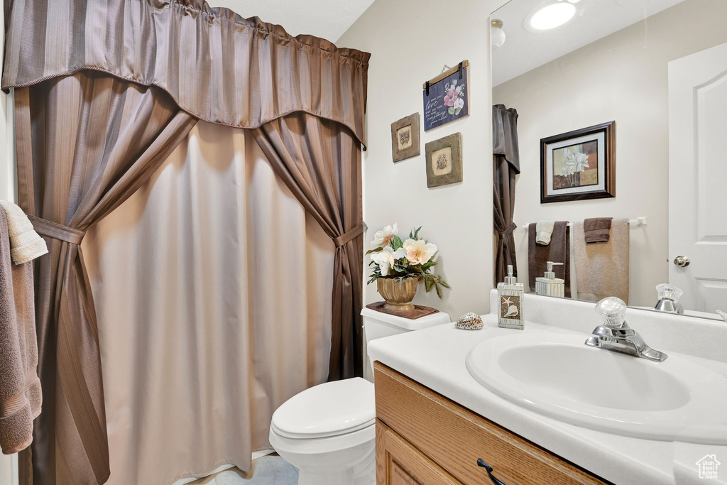 Bathroom featuring toilet and vanity
