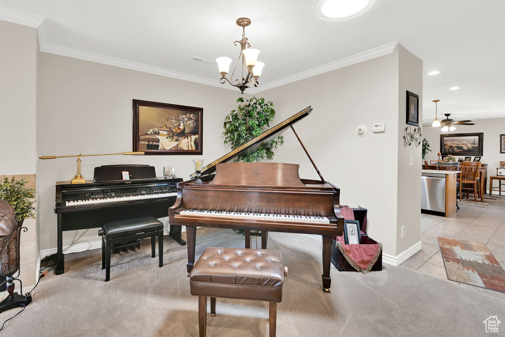 Sitting room with a chandelier, ornamental molding, ceiling fan, baseboards, and recessed lighting