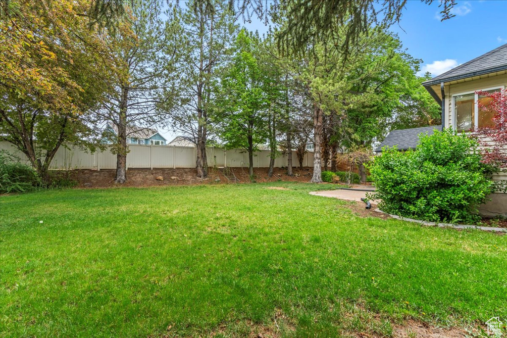 View of yard with fence
