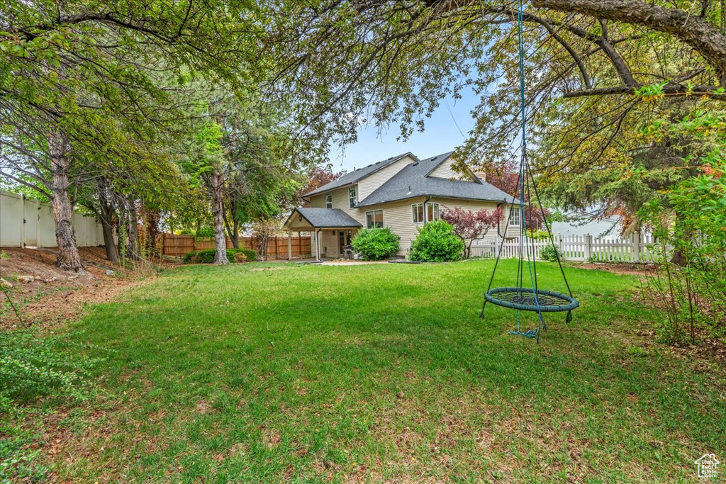 View of yard with a gazebo and a fenced backyard