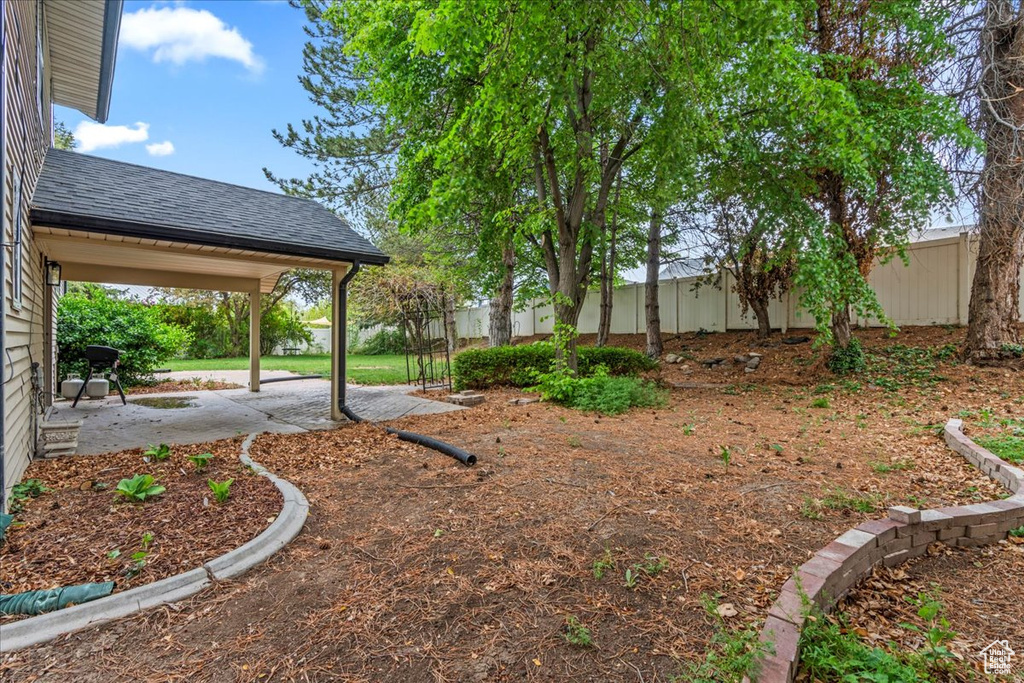 View of yard featuring a patio and a fenced backyard