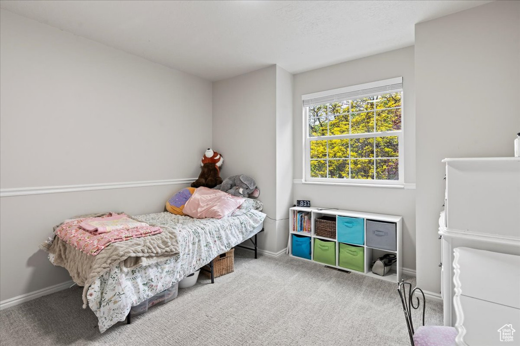 Bedroom with carpet and baseboards