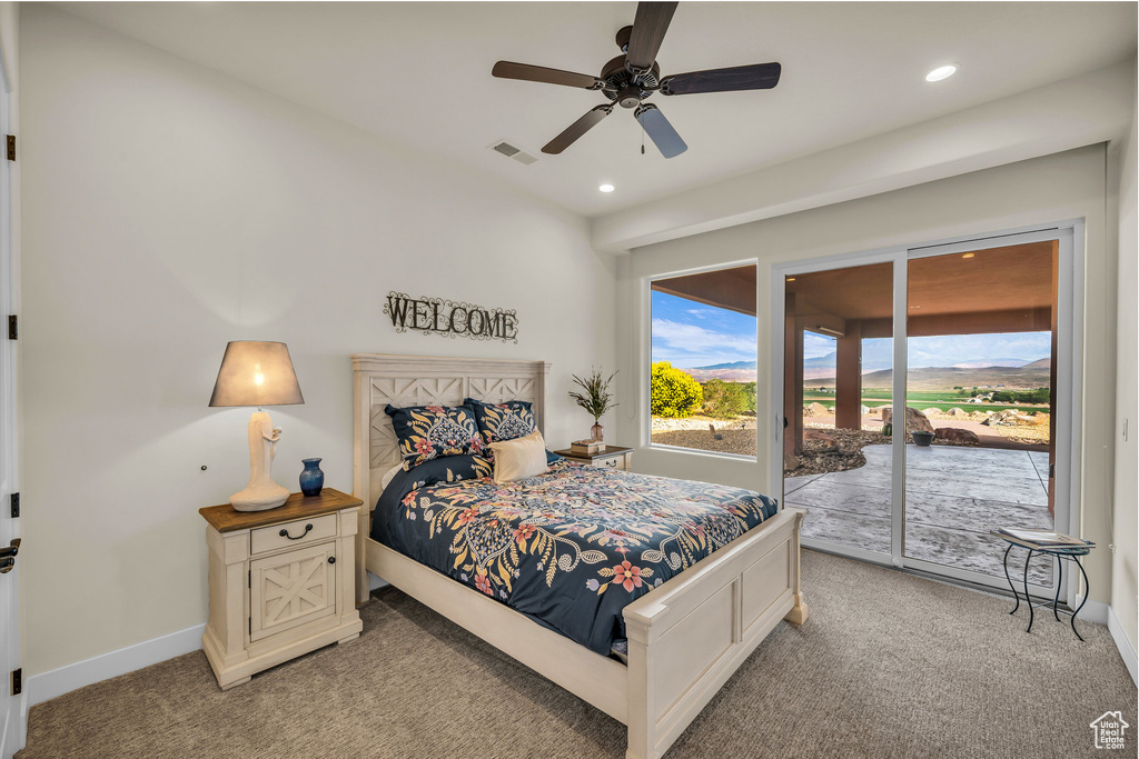 Bedroom featuring light colored carpet, recessed lighting, visible vents, and access to exterior