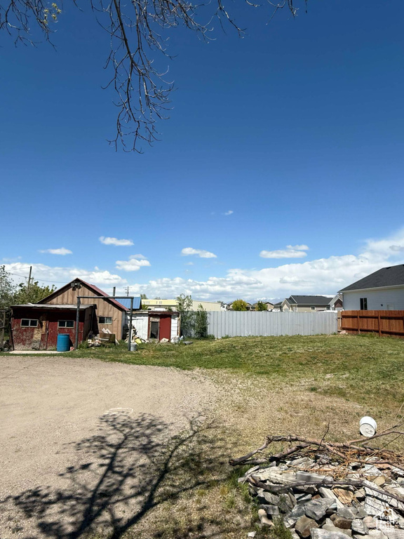View of yard featuring fence