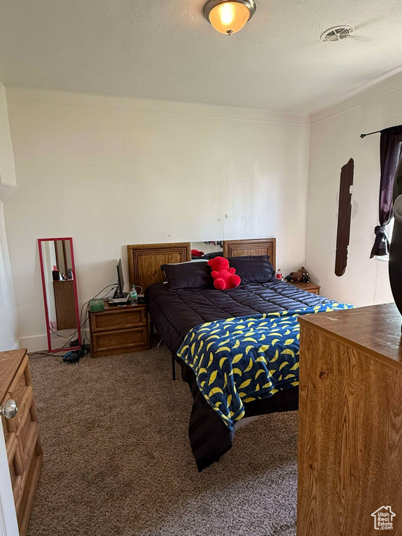 View of carpeted bedroom