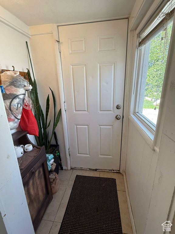Entryway featuring light tile patterned flooring