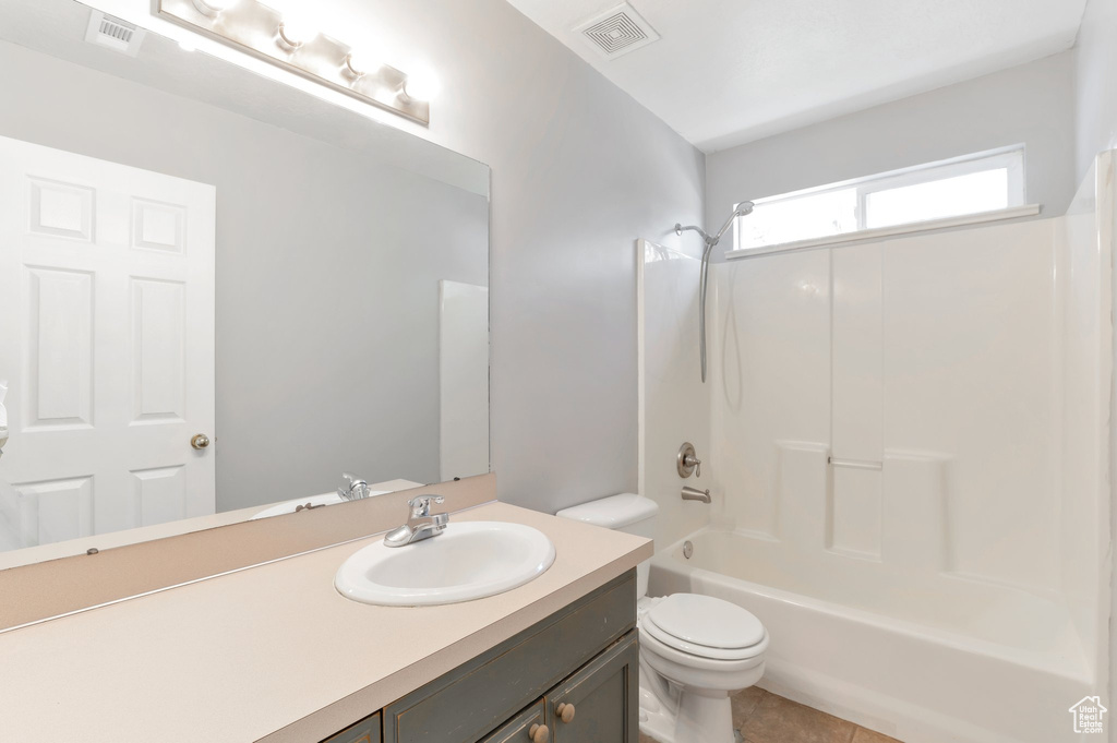 Full bath featuring toilet, shower / bathtub combination, vanity, and visible vents