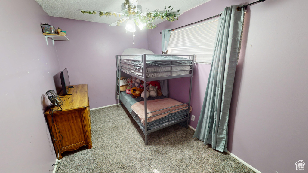 Carpeted bedroom with baseboards