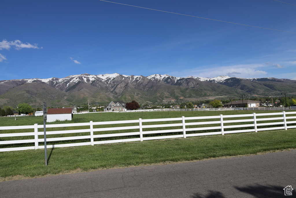 Property view of mountains with a rural view