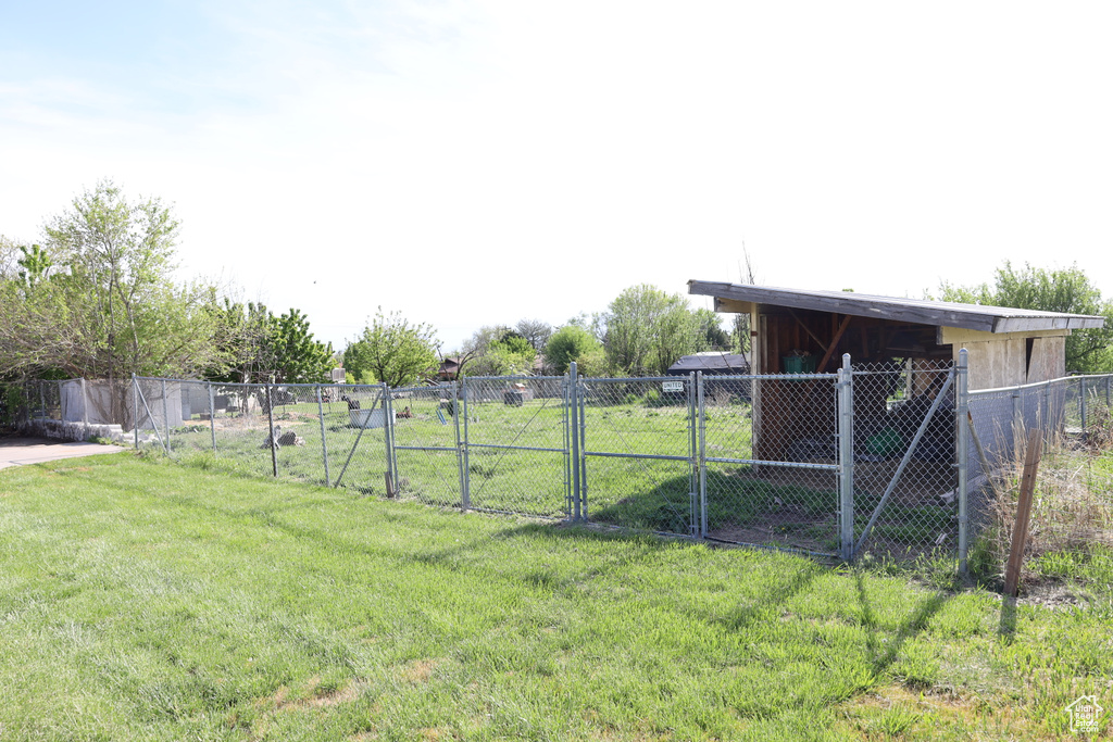 View of yard featuring a gate and fence