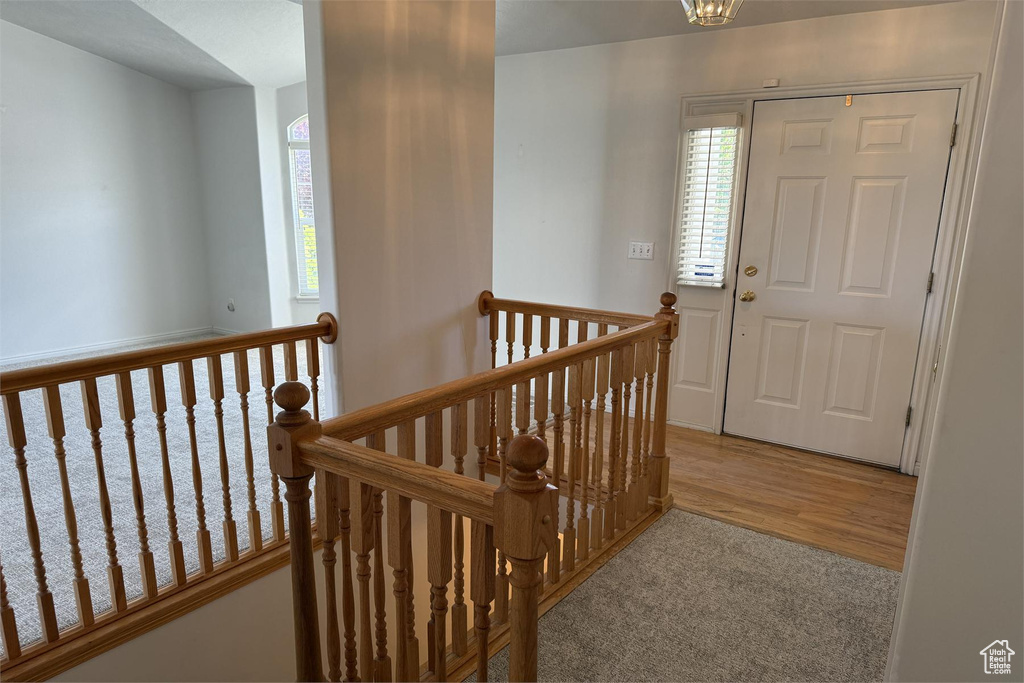 Entrance foyer with wood finished floors