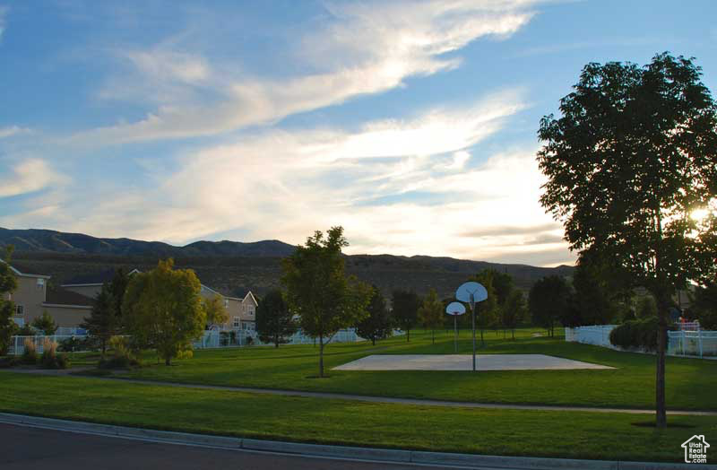 View of property's community with a mountain view and community basketball court