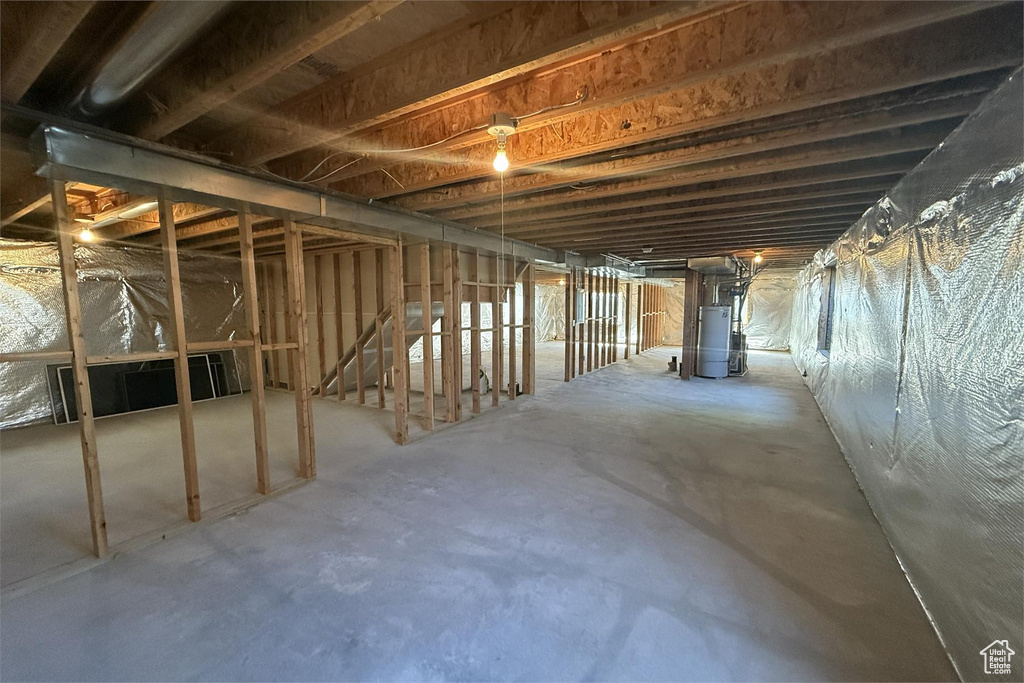 Unfinished basement with gas water heater