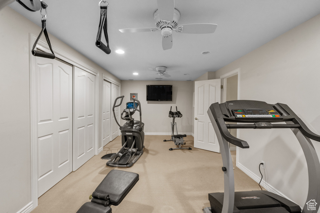 Exercise area featuring baseboards, carpet, a ceiling fan, and recessed lighting