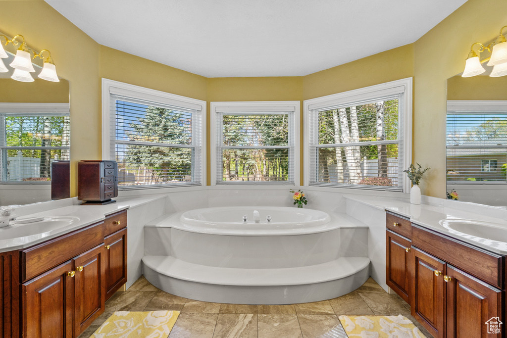 Bathroom featuring vanity and a garden tub
