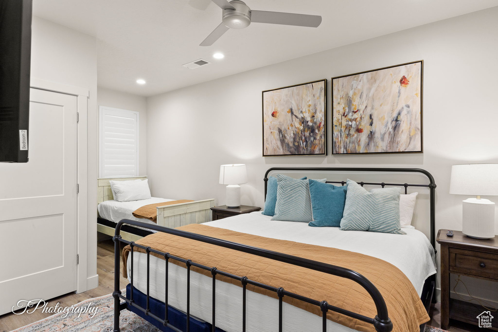 Bedroom featuring visible vents, wood finished floors, a ceiling fan, and recessed lighting