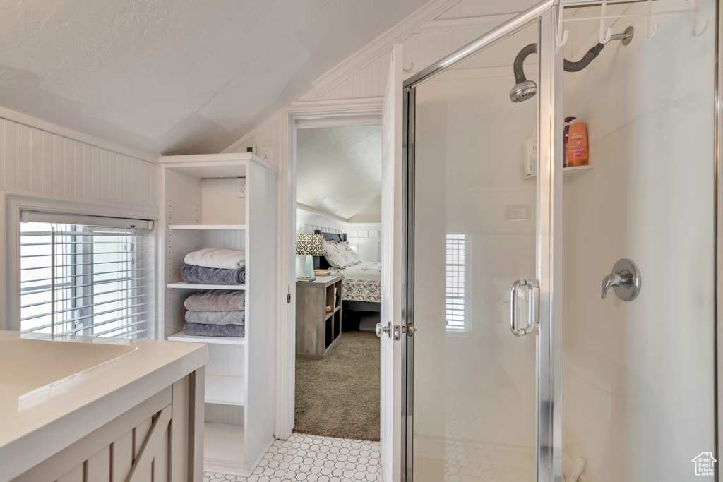 Ensuite bathroom with ensuite bath and a stall shower