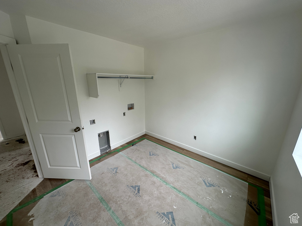 Washroom with baseboards and laundry area