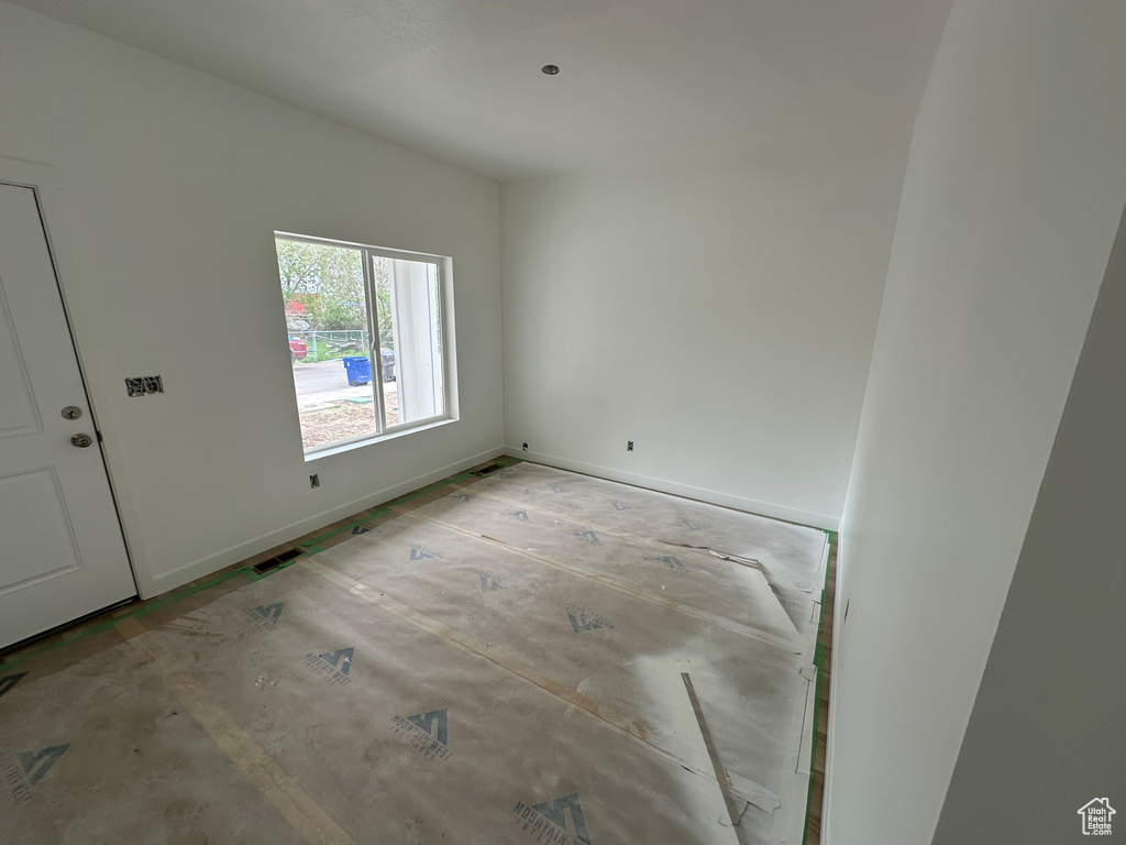 Empty room with baseboards and visible vents