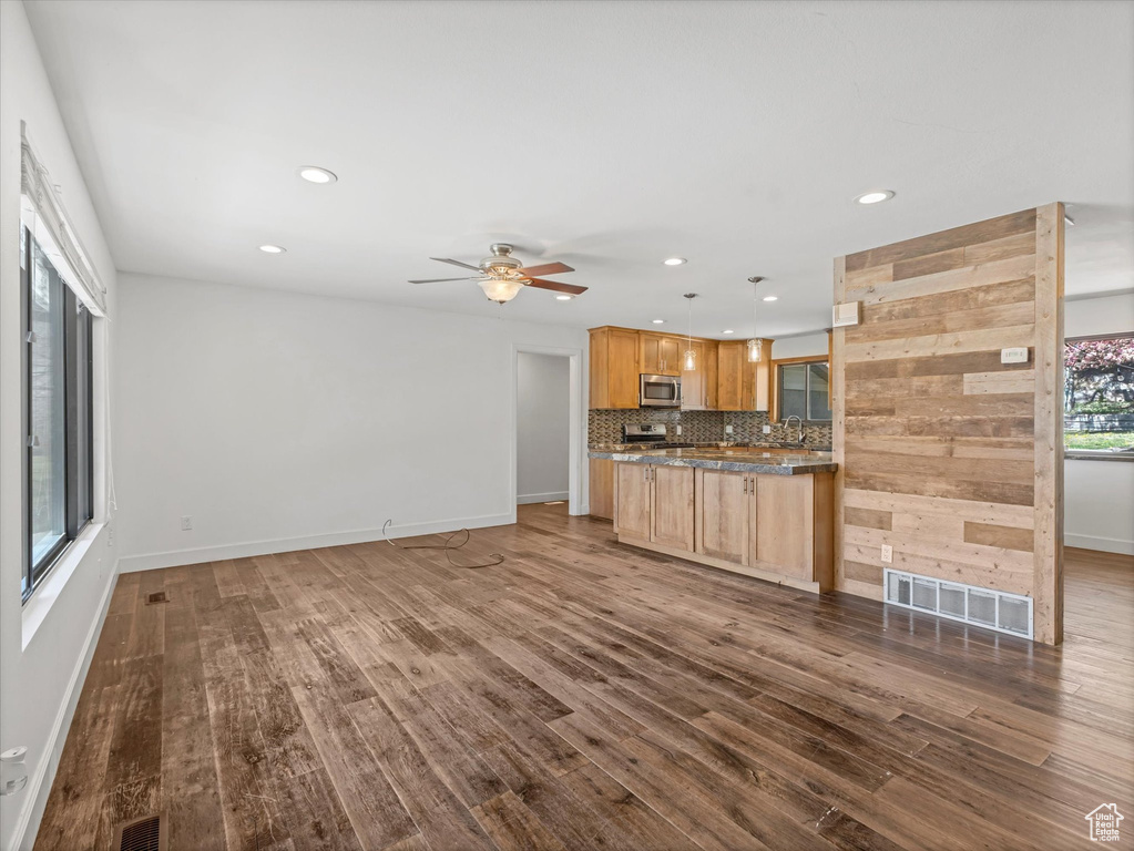 Kitchen with recessed lighting, backsplash, visible vents, and appliances with stainless steel finishes