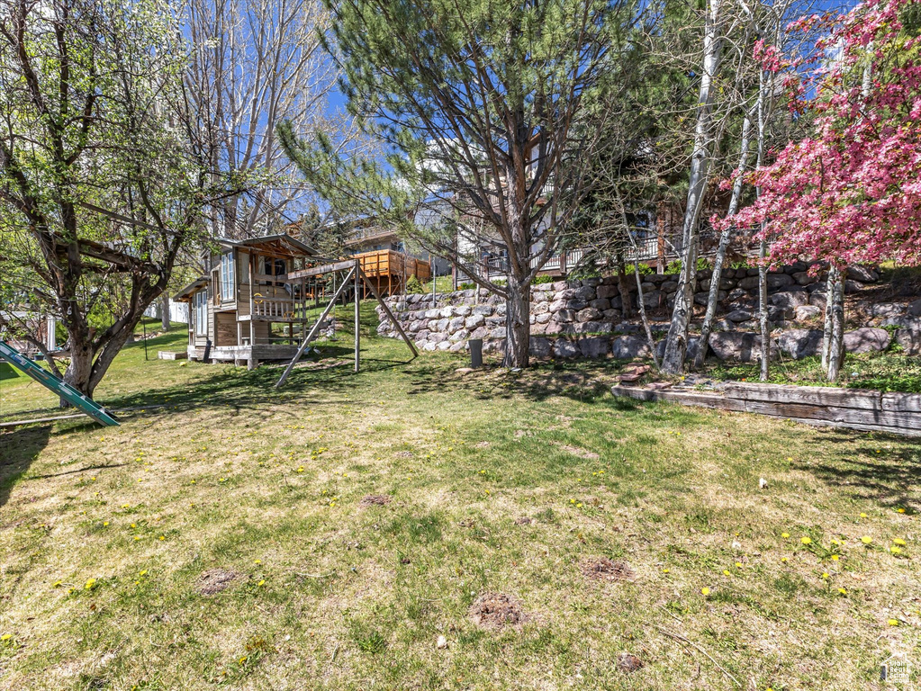 View of yard featuring a wooden deck