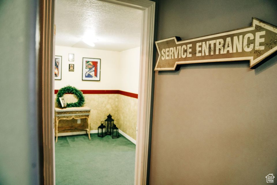 Interior space featuring baseboards and carpet floors