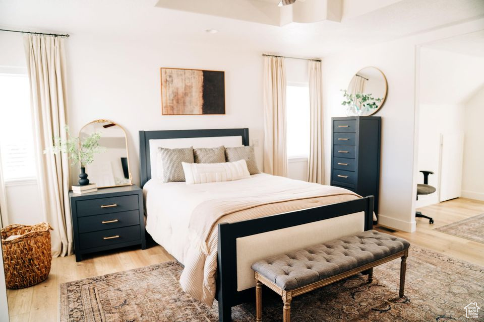Bedroom with baseboards and light wood-type flooring