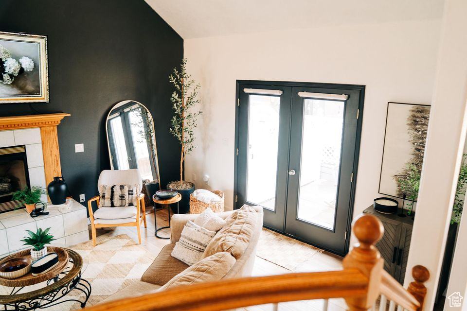 Living room with a fireplace and french doors