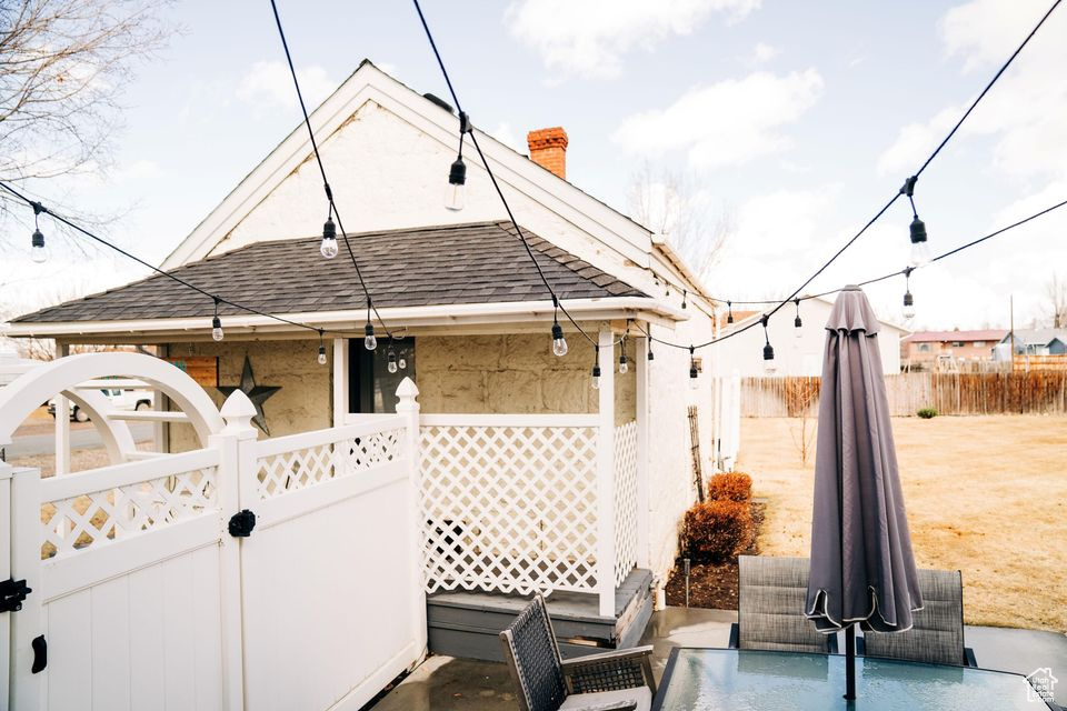 View of patio with fence