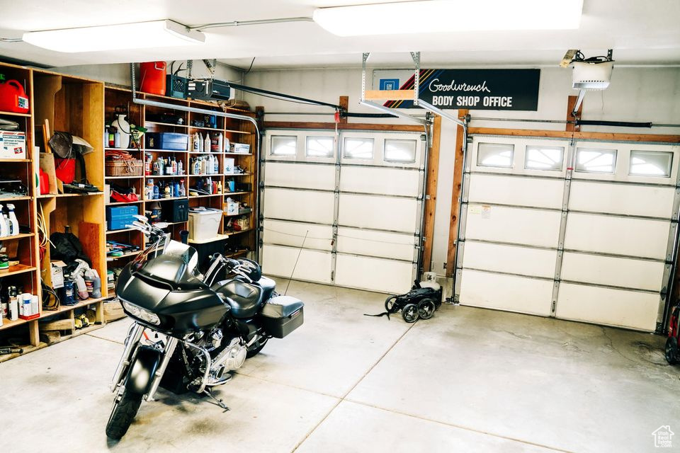 Garage featuring a garage door opener
