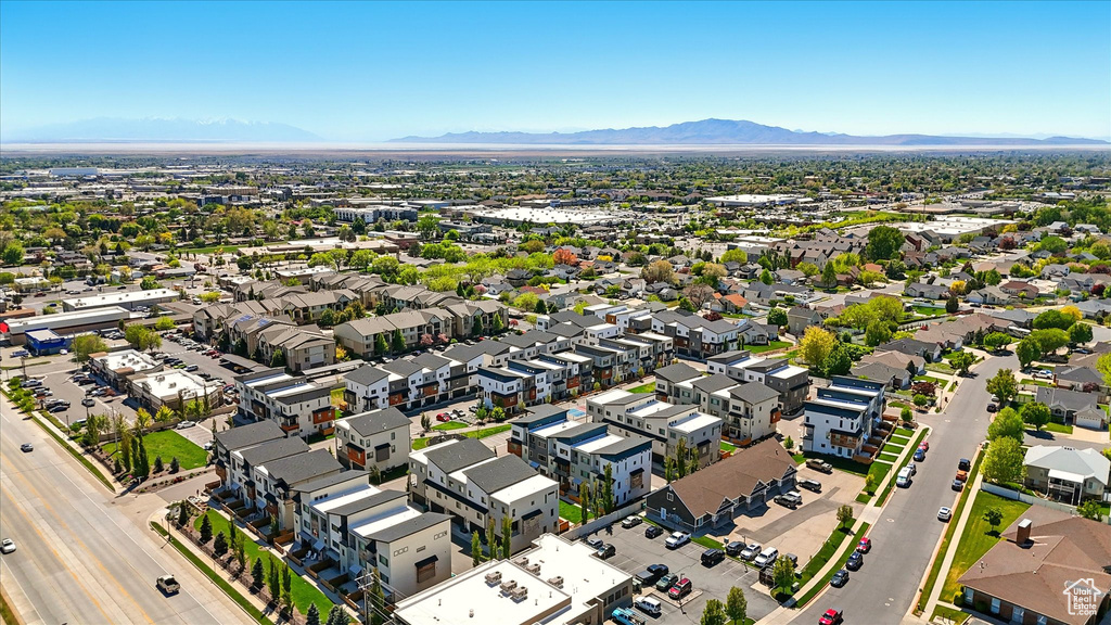 Birds eye view of property with a residential view and a mountain view