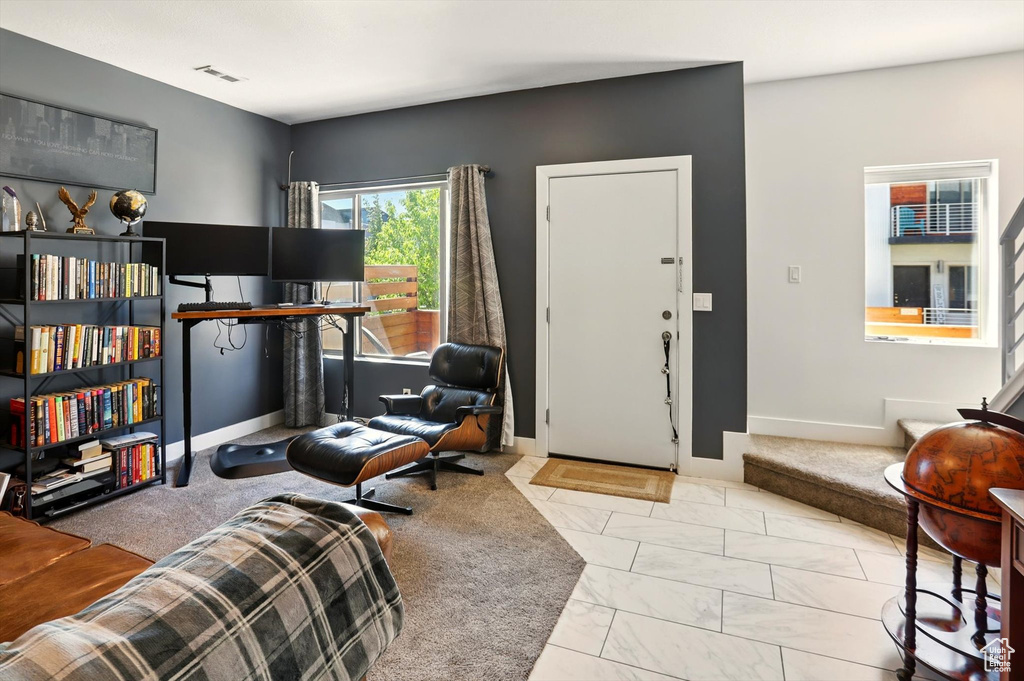 Living room with baseboards and visible vents