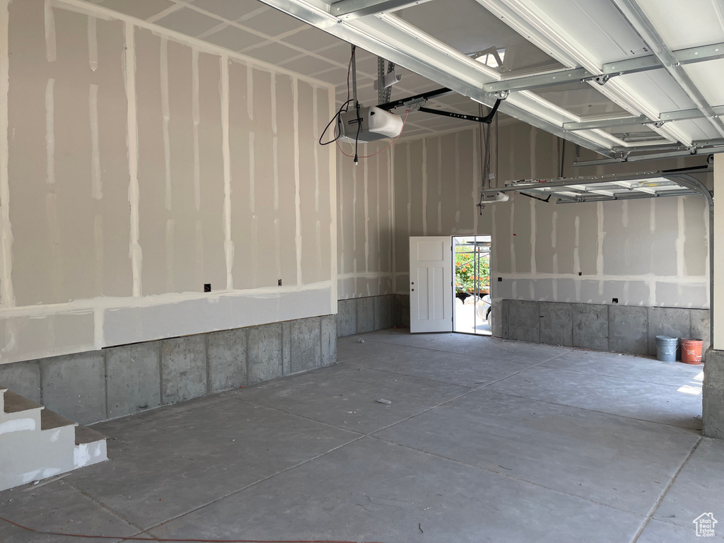 Garage featuring a garage door opener
