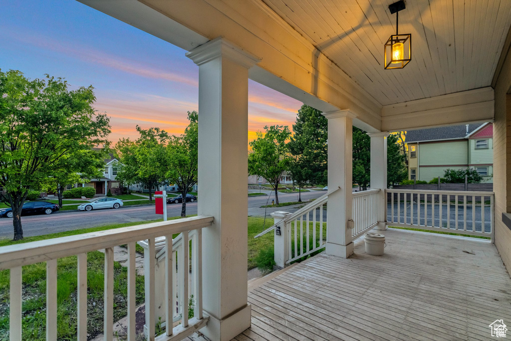 Deck at dusk with a porch