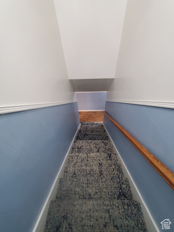 Stairs featuring baseboards