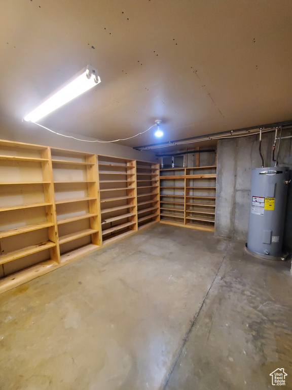 Garage featuring electric water heater