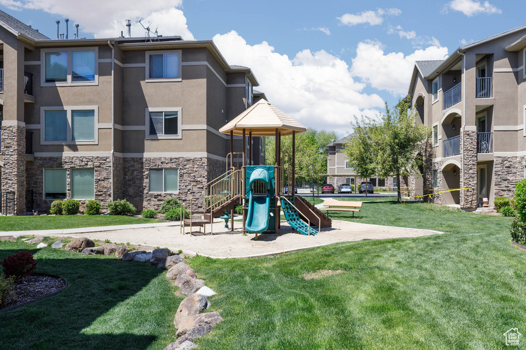 Community playground featuring a lawn