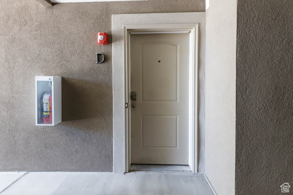 Entrance to property featuring stucco siding