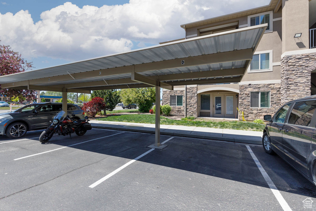 Covered parking lot featuring french doors
