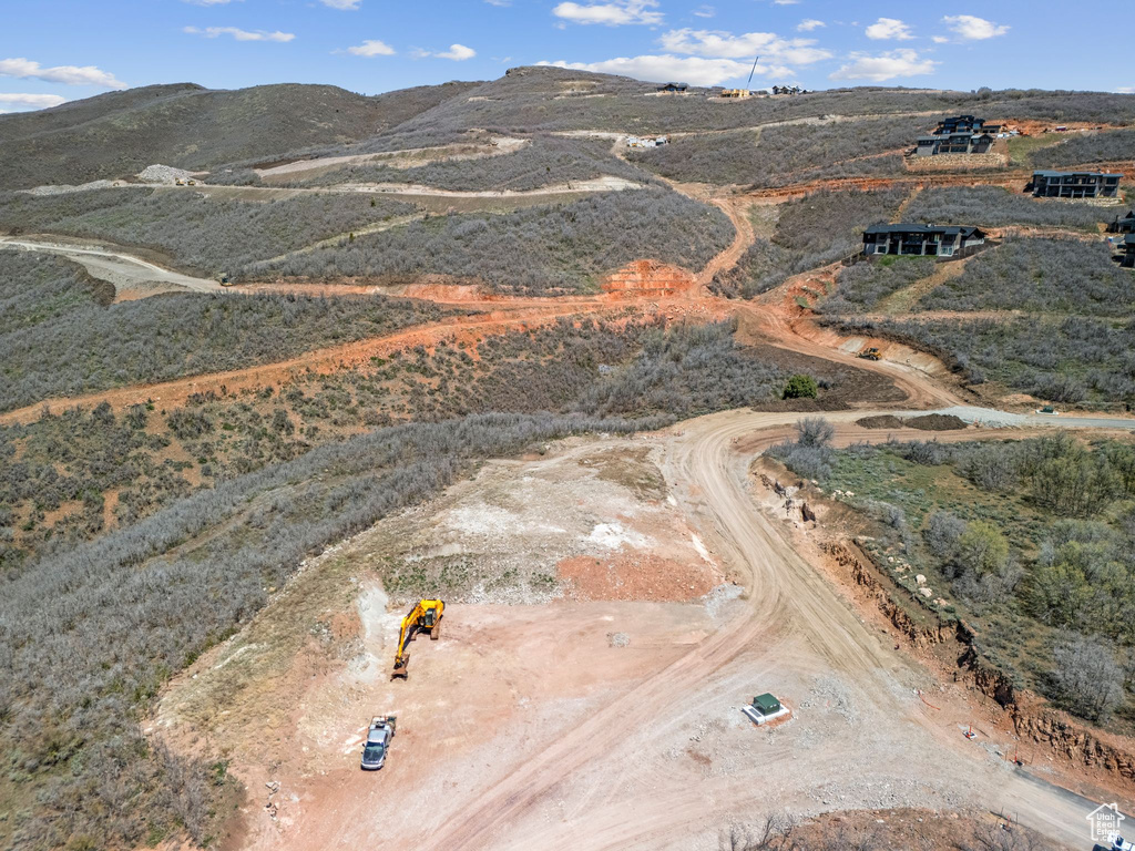 Birds eye view of property with a rural view and a mountain view
