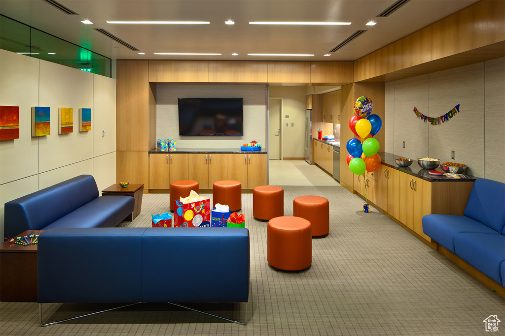 Recreation room featuring recessed lighting, light carpet, and visible vents
