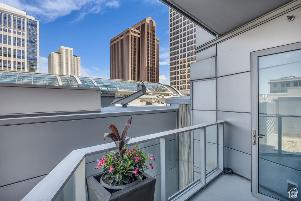 Balcony featuring a view of city