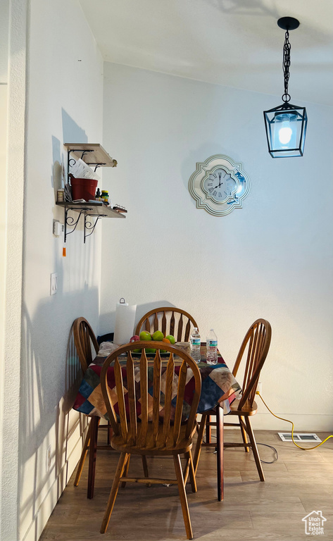 Dining room featuring visible vents and light wood-style flooring