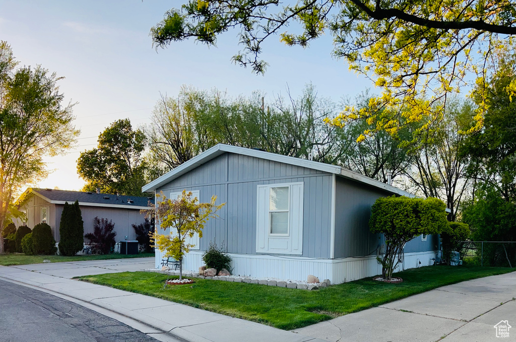 Exterior space with a front lawn and fence